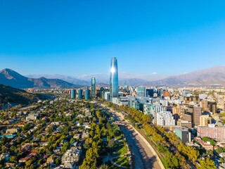 Aerial panoramic view of Santiago city skyline with Gran Torre skyscraper and the Andes mountains in Chile