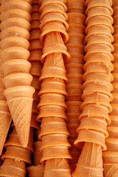 Stacked waffle ice cream cones pattern background food texture