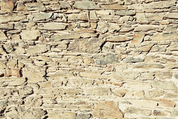Fototapeta premium Warm Toned Ancient Stone Wall Masonry Texture