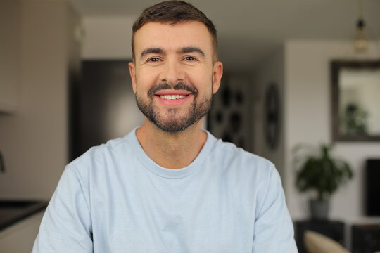 Handsome Man Smiling Confidently at the Camera