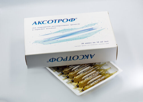 Aksotrof drinking ampoules, specialized medical nutrition product packaging closeup.
