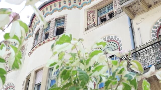 Beautiful Art Nouveau Building Seen Through Green Leaves