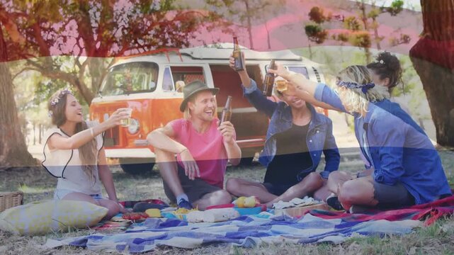 Animation of flag of netherlands over diverse group of friends having party outdoors