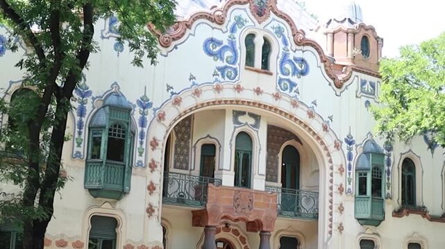 Cinematic static view of ornate historic European house facade with Art Nouveau details