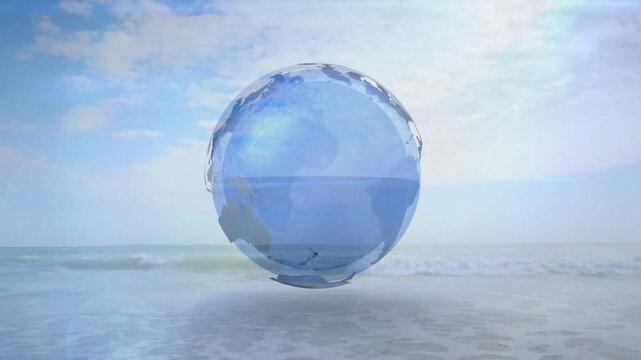 Glass globe emerging above calm sea showing continent outlines rotating slowly for tech marketing