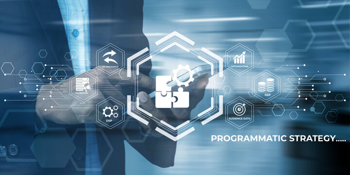 Man in suit using smartphone with digital abstract graphic interface displaying programmatic strategy concept icons and data flow elements