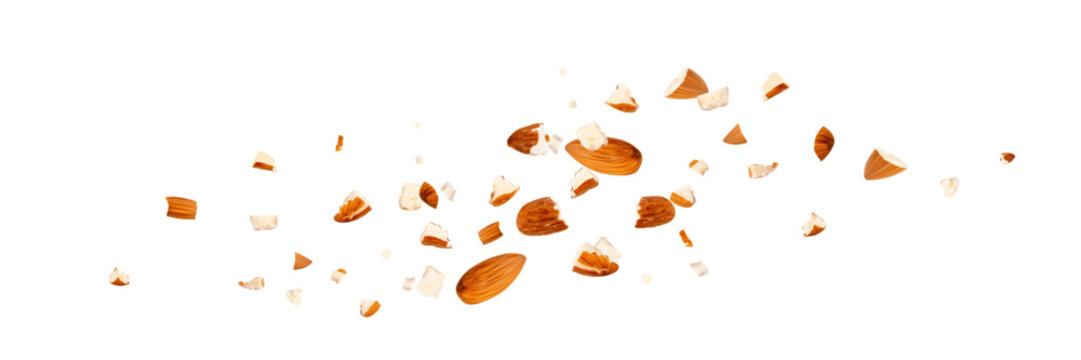 Crushed almonds falling isolated, flying nut pieces, levitate scattered almond seeds