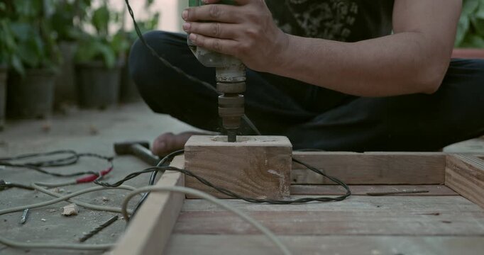 Beginner carpenter working with professional tools on wood and metal, creating sparks while cutting and grinding in a dynamic workshop environment