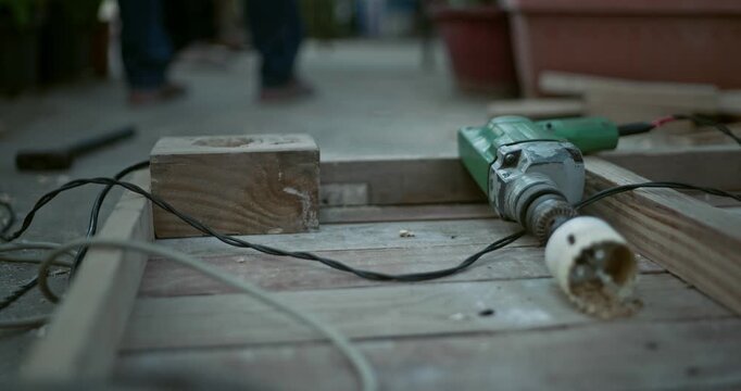Beginner carpenter using professional tools while working on wood, capturing real workshop moments and skill development in action