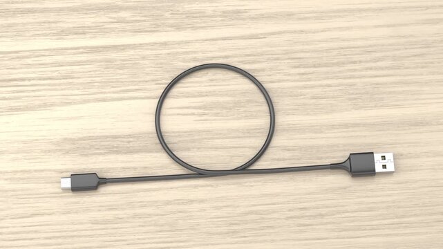 USB-A to USB-C data cable on a wooden table
