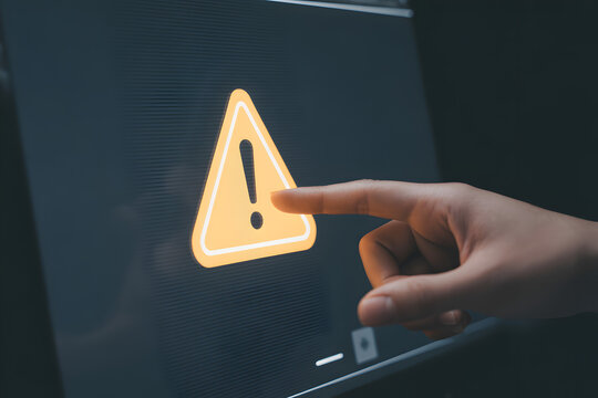 Human Finger Touching Digital Warning Sign with Triangle Exclamation Mark Icon, Alert System Notification for Cyber Security Threat, Emergency Error and Risk Management in Modern Digital Environment