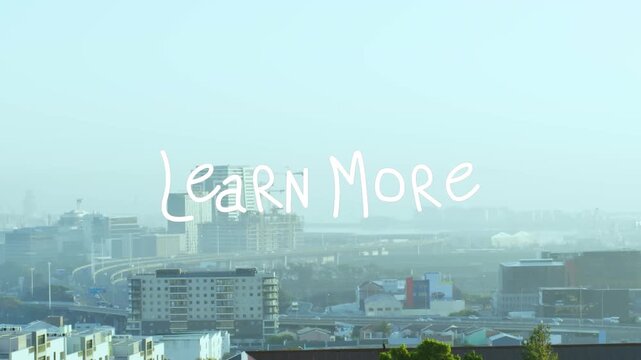 Animation of learn more text banner against aerial view of cityscape
