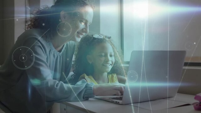 Woman powering up laptop and guiding daughter's typing in home education, adjusting hand placements
