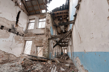 Dilapidated Abandoned Building Interior With Collapsed Roof, Exposed Brick Walls, Blue Paint Remnants And Debris Littered Floor In Derelict State Showing Decay And Neglect Over Time © Galka3250