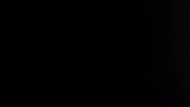Real Shooted Anamorphic Lens Flare Transitions on Black Background in Slow Motion.