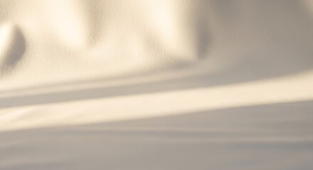 Obraz premium a close-up view of a beige fabric with sunlight shining on it