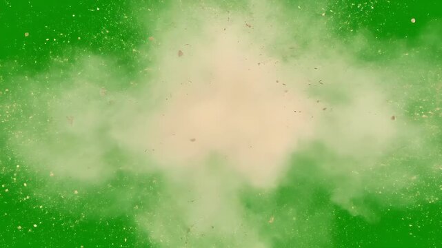 Dust cloud exploding from center with flying debris on green screen