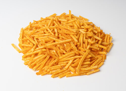 Fried chips sticks isolated, finger potato chips, golden shoestring fries pile, French fries