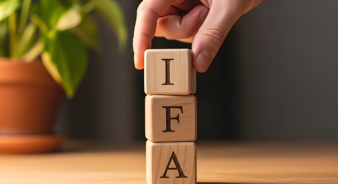 IFA - Financial Advice Acronym - Wooden Blocks - Hand Stacking