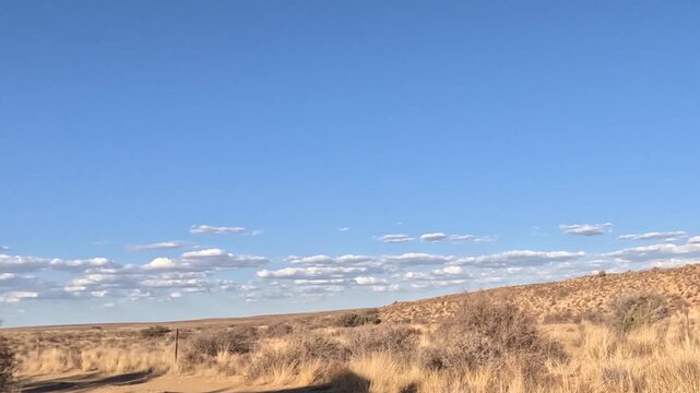 Time-lapse of thin white cloads far in the distance on a Karoo semi-arid landscape. 4K Video