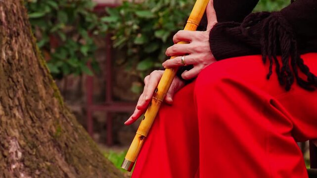 Close Up of Woman Hands Playing Traditional Ney Reed Flute