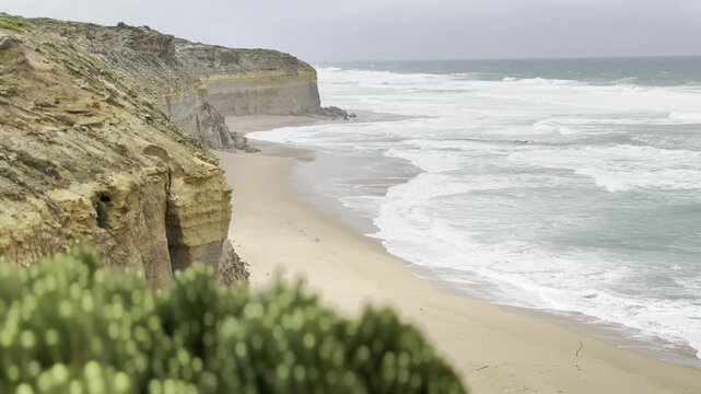 Powerful waves crashing against the limestone cliffs, stacks of the Twelve Apostles in Port Campbell National Park on the Great Ocean Road, Victoria, Australia