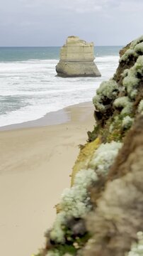 Powerful waves crashing against the limestone cliffs, stacks of the Twelve Apostles in Port Campbell National Park on the Great Ocean Road, Victoria, Australia