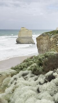 Powerful waves crashing against the limestone cliffs, stacks of the Twelve Apostles in Port Campbell National Park on the Great Ocean Road, Victoria, Australia