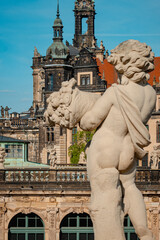 Obraz premium Vibrant Scene Showing Baroque Cherub Overlooking Dresden With Detailed Architecture Against Clear Sky