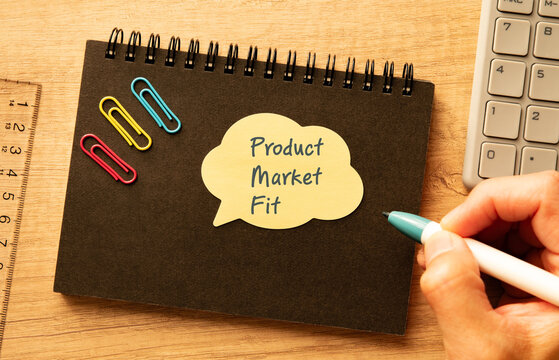 Business concept of Product Market Fit represented on speech bubble with calculator, clips, ruler. Ideal for marketing and promotional content.