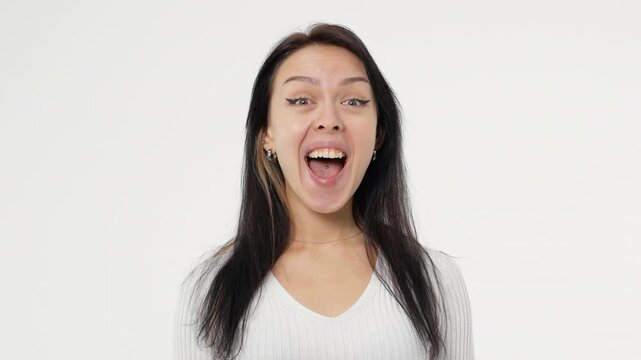 Pretty adult young woman pleasant surprise looking around in white space background copy space