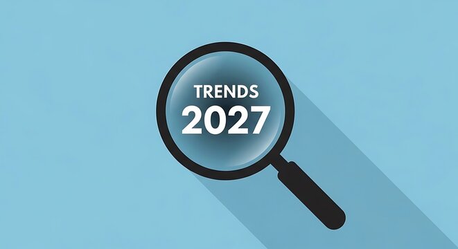 Magnifying glass showing the word trends and the year 2027 with shadow with looking ahead with future trends