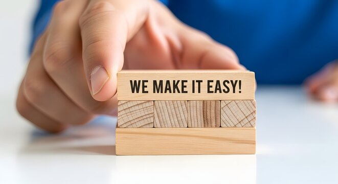 We Make It Easy: Business Concept, Hand Placing Wooden Block