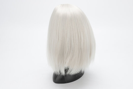 Plastic Mannequin Head with Silver Wig on White Background