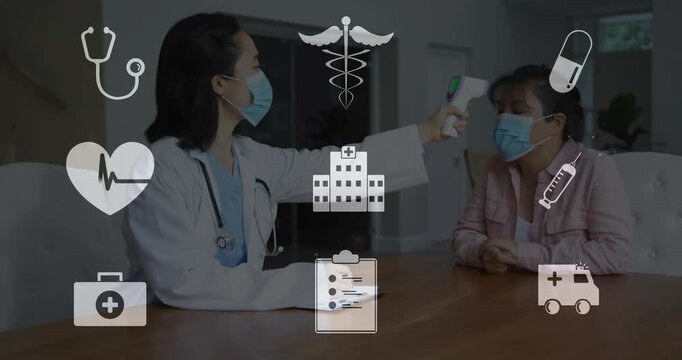 Measuring doctor labcoat stethoscope raising IR thermometer at clinic checking tablet with patient