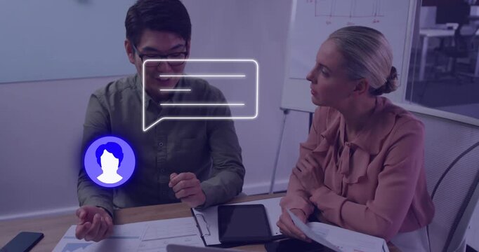 Man tapping tablet and pointing, woman holding pages for business data causing spinning chat bubble