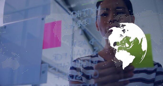Globe overlay appearing, rotating on glass, woman writing, placing sticky notes for business plan