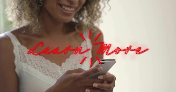 Learn More prompt appearing, adult woman tapping phone, smiling while exploring marketing content