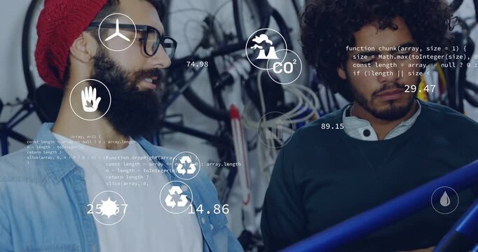 Vertical video: Left tech leaning on blue frame activating AR icons while partner checking CO2 data