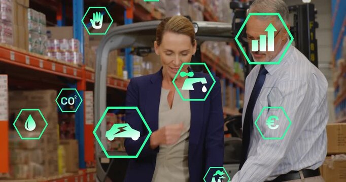 Managers tapping surface and leaning to laptop, floating hex icons guiding supply-chain decisions