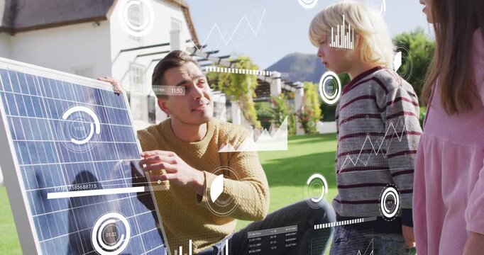 Vertical video: Man touching solar cell and teaching kids solar energy in yard, HUD showing cells
