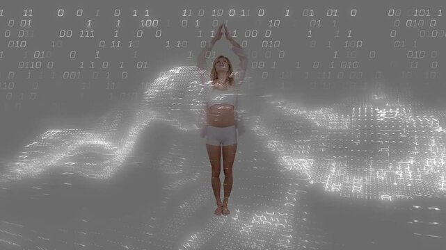 Woman reacting to glowing digital grid, bits falling, moving arms out, overhead, back to clasp