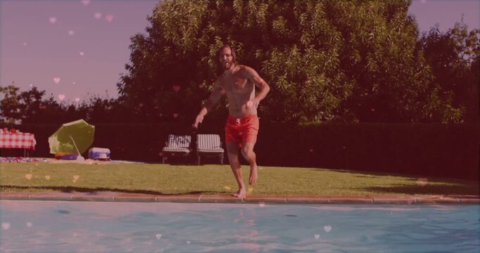 Man in red trunks running, jumping into pool, creating splash with pink heart overlay for health