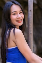 Fototapeta premium Smiling Woman in Blue Outfit during Vacation on Koh Si Chang Island