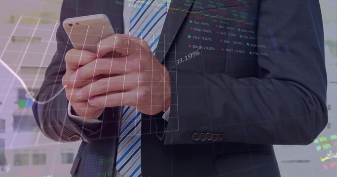 Executive in dark suit striped tie holding smartphone at office windows, with financial overlays