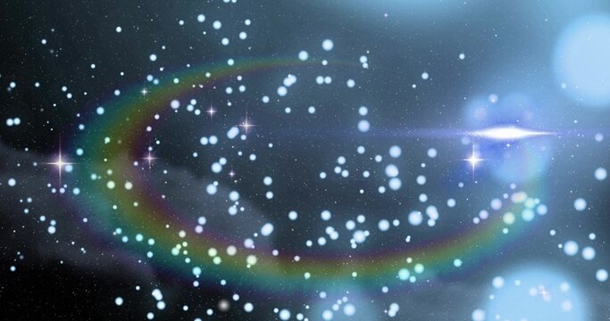 Sweeping multicolor flare arc and bright star cluster crossing deep-space, showing blue bokeh
