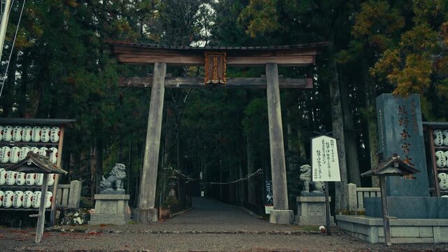 Cinematic entrance of Kumano Hongu Taisha Grand Shrine with Torii gate and stone steps, Japan.
