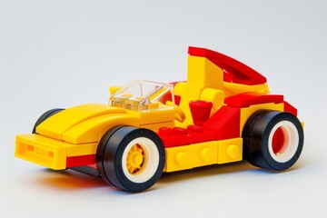 Obraz premium Toy block car lego yellow red simple design white background kids building playful construction model