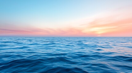 Naklejka premium Serene Ocean View at Sunset with Soft Blue Waves and Colorful Skies Above Horizon