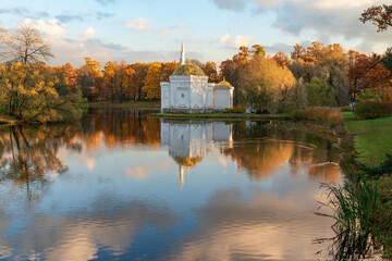 Fototapeta premium The pavilion of the Turkish Bath on the shore of the Great pond in the Catherine Park of Tsarskoye Selo on a sunny autumn day, Pushkin, St. Petersburg, Russia